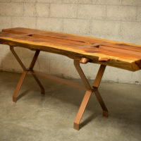 Redwood slab table with integrated trough for wine