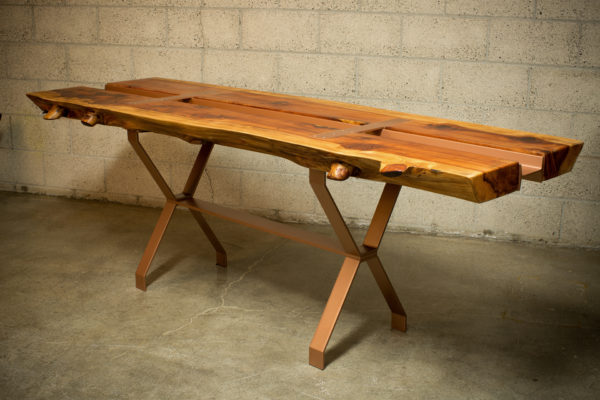 Redwood slab table with integrated trough for wine