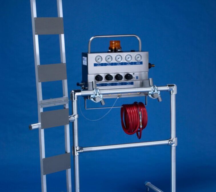 A ladder with hoses and a fire extinguisher.
