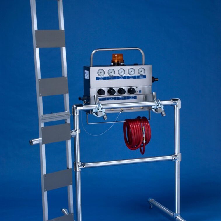 A ladder with hoses and a fire extinguisher.